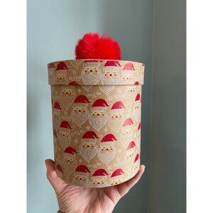 Santa-Themed Round Gift Box With Red Pom-Pom Lid & "Be Merry" Print